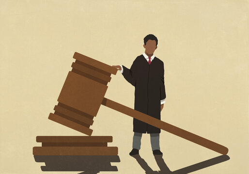 Male judge standing at large gavel
