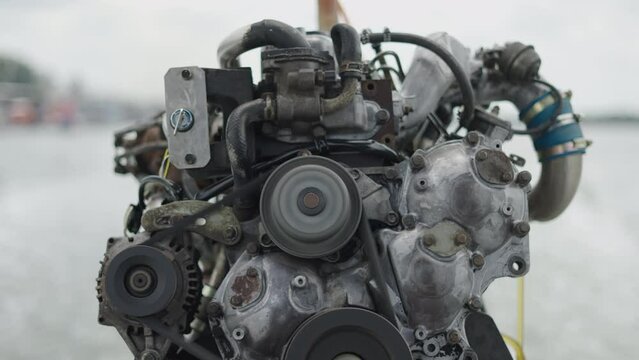 Working car engine remodeled and installed on a boat in Thailand