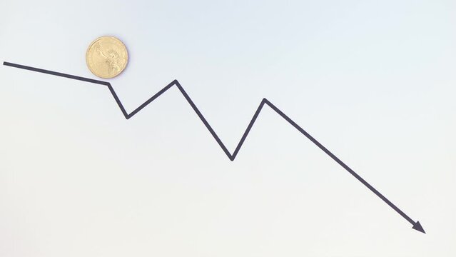 United States currency exchange rate, value falling concept. 1 one US dollar coin reverse side, Statue of Liberty up, moving down the single line graph towards arrow on white background, copy space.