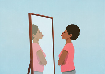 Woman sticking tongue out at mirror
