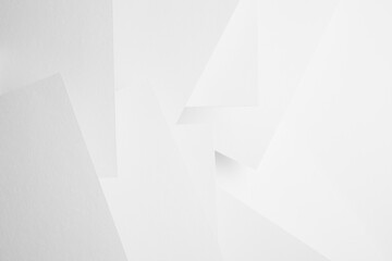 White abstract geometric background with soft light paper surfaces fly as random volumetric pattern...