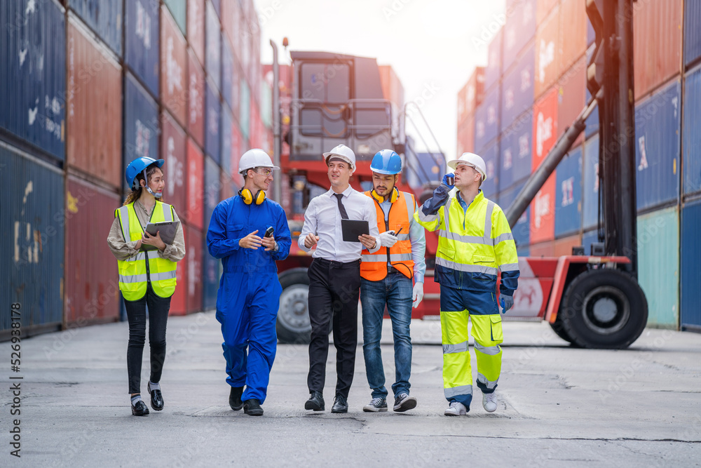 Poster Manager and Supervisor dock cargo checking and control loading Containers box at Container yard warehouse,Unity and teamwork concept.