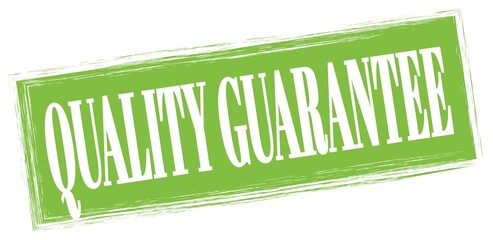 QUALITY GUARANTEE text written on green stamp sign.