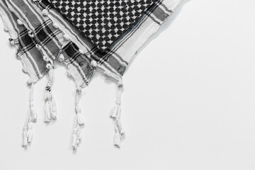 A traditional head-tied garment 'Keffiyeh' or 'Puşi' on a white isolated background. Keffiyeh is...