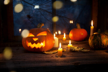 Halloween background, pumpkins stand in a row on the background of a barn window