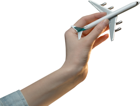 Hand holding metal toy plane