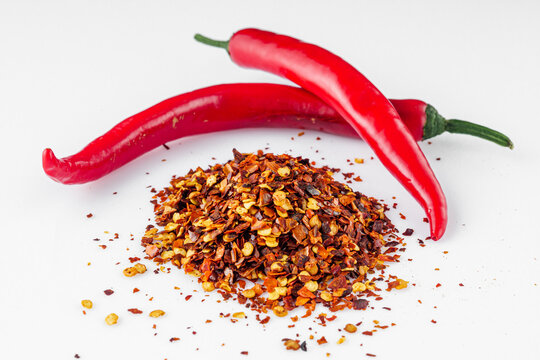 spicy chili flakes on a white background