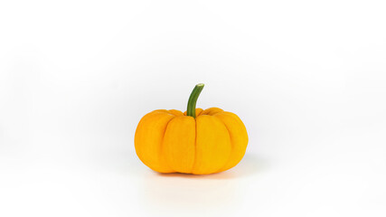 Orange pumpkin isolated on white background with copy space. Beautiful Halloween pumpkin side view. Pumpkin as a superfood for vegetarians. Healthy food concept.