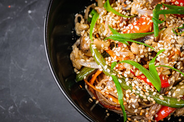 delicious chinese fried noodles on a black background