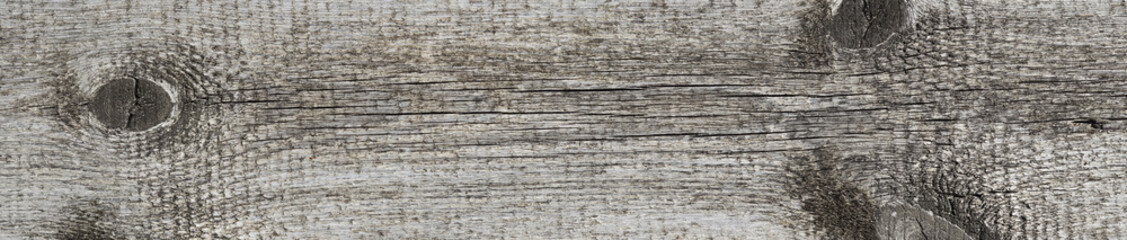 The texture of the wooden brown surface of the board with natural patterns.Natural wood background with panoramic view