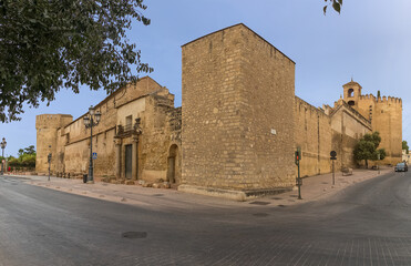 Exterior view at the Alcázar of the Christian Monarchs fortress or Alcázar of Córdoba and La Paloma Tower, a medieval alcázar located in the historic centre of Córdoba city - obrazy, fototapety, plakaty