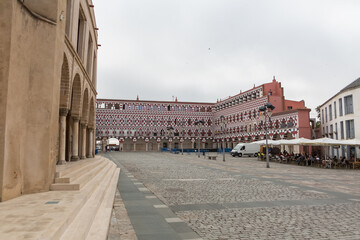 Fototapeta na wymiar iew at the exterior at the iconic High Square Badajoz, Plaza Alta de Badajoz, with typical colored house buildings , Badajoz, Spain
