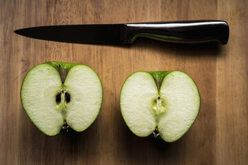 sliced green apple on cutting board
