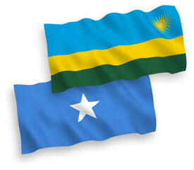 National vector fabric wave flags of Republic of Rwanda and Somalia isolated on white background. 1 to 2 proportion.