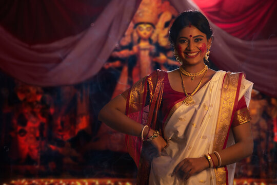 Portrait of a married Bengali woman with sindoor on face 