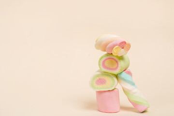 Marshmallows on light background with copy space, pyramid of candies