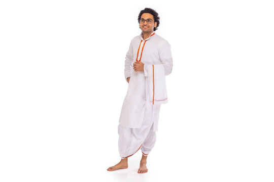 Portrait of Bengali man standing with hand on waist against white background