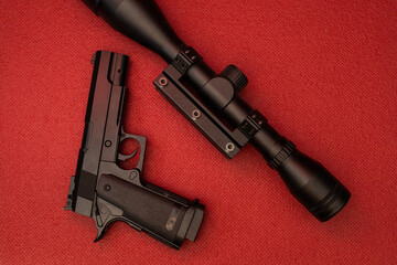 Black gun on red background