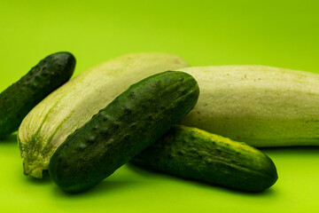 Cucumbers on a green background, monochrome