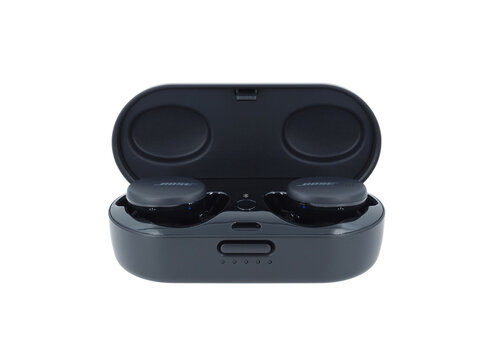 ROME, ITALY - AUGUST 30, 2022. Bose sport earbuds carry case isolated on white background. Bose corporation designs, develops and sells audio equipment.