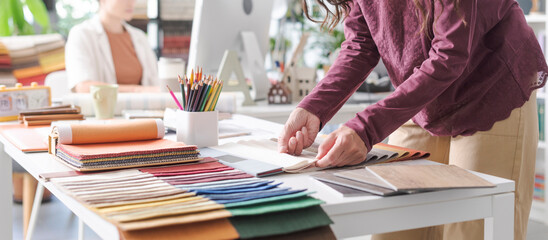 Designer choosing fabric swatches for her project