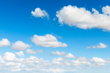 Naklejka na ściany i meble Blue sky background with cumulus clouds
