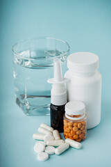 various medicines on a blue paper background
