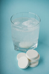 various medicines on a blue paper background