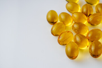 fish oil in omega 3 capsules on a white background