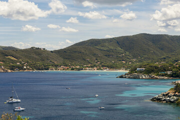 Spiaggia di Procchio and Spartia Beach, rare motor boats and yachts in turquoise water lagoons and...