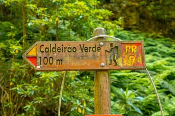 Signs on the trekking trail next to the waterfall in Levada do Caldeirao Verde, Queimadas, Madeira