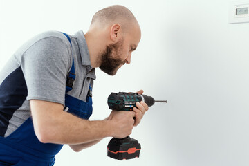 Professional handyman using a drill