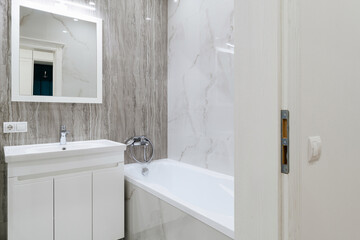 Fototapeta na wymiar stylish bathroom interior design with tiles and lighting