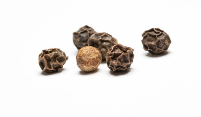 heap of black pepper, close-up macro photo. front view on white background