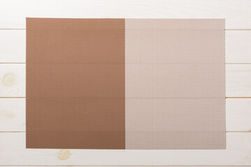 Fototapeta premium Top view of brown tablecloth for food on wooden background. Empty space for your design
