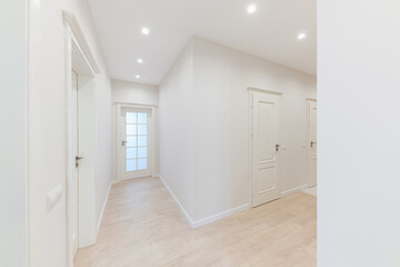 a large bright corridor in the new interior design of the house