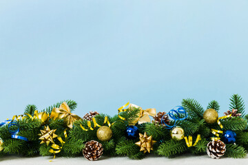 New Year Christmas tree toy, branches of a christmas tree, New Year decorations on a colored...