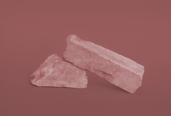 Tinted in beige Stone podium for jewellery, products, cosmetics, cream or perfumes on an yellow background.