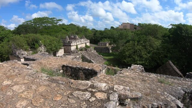 View of the Maya archeological site of Ek' Balam in Yucatan, Mexico. Mayan ruins in the jungle with ancient buildings for tourism and travel