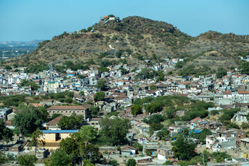 A hilltop view of a small village in the hilly region of India