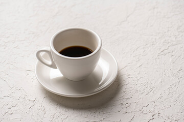 close-up shot of cup of coffee on white tabletop