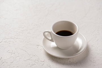 close-up shot of cup of coffee on white tabletop