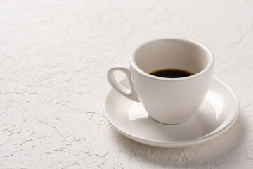 close-up shot of cup of coffee on white tabletop