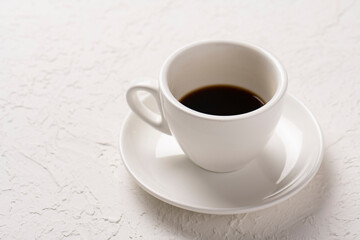 close-up shot of cup of coffee on white tabletop