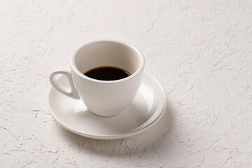 close-up shot of cup of coffee on white tabletop