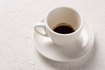 close-up shot of cup of coffee on white tabletop