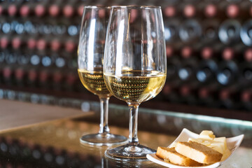 Wine tasting in the winery - 2 glasses of white wine with toasts and cheese, Lanzarote, Spain