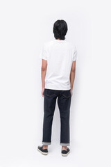 Full body portrait of a rear view young man in a white t-shirt. jeans , casual fashion.