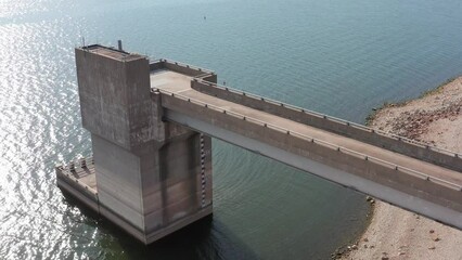 Aerial bird's eye close-up shot of the control tower at the Clinton Lake Dam in Kansas. 4K