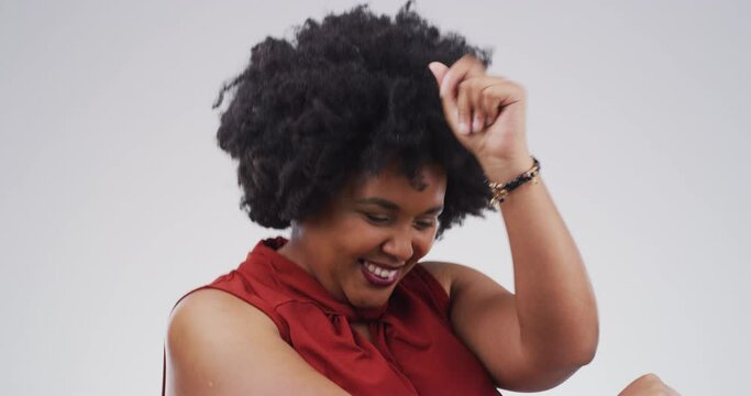 Dance, freedom and party black woman dancing, swaying and moving with fun expression, playful energy and happy attitude on studio background. Portrait of disco, music and crazy dancer with motivation